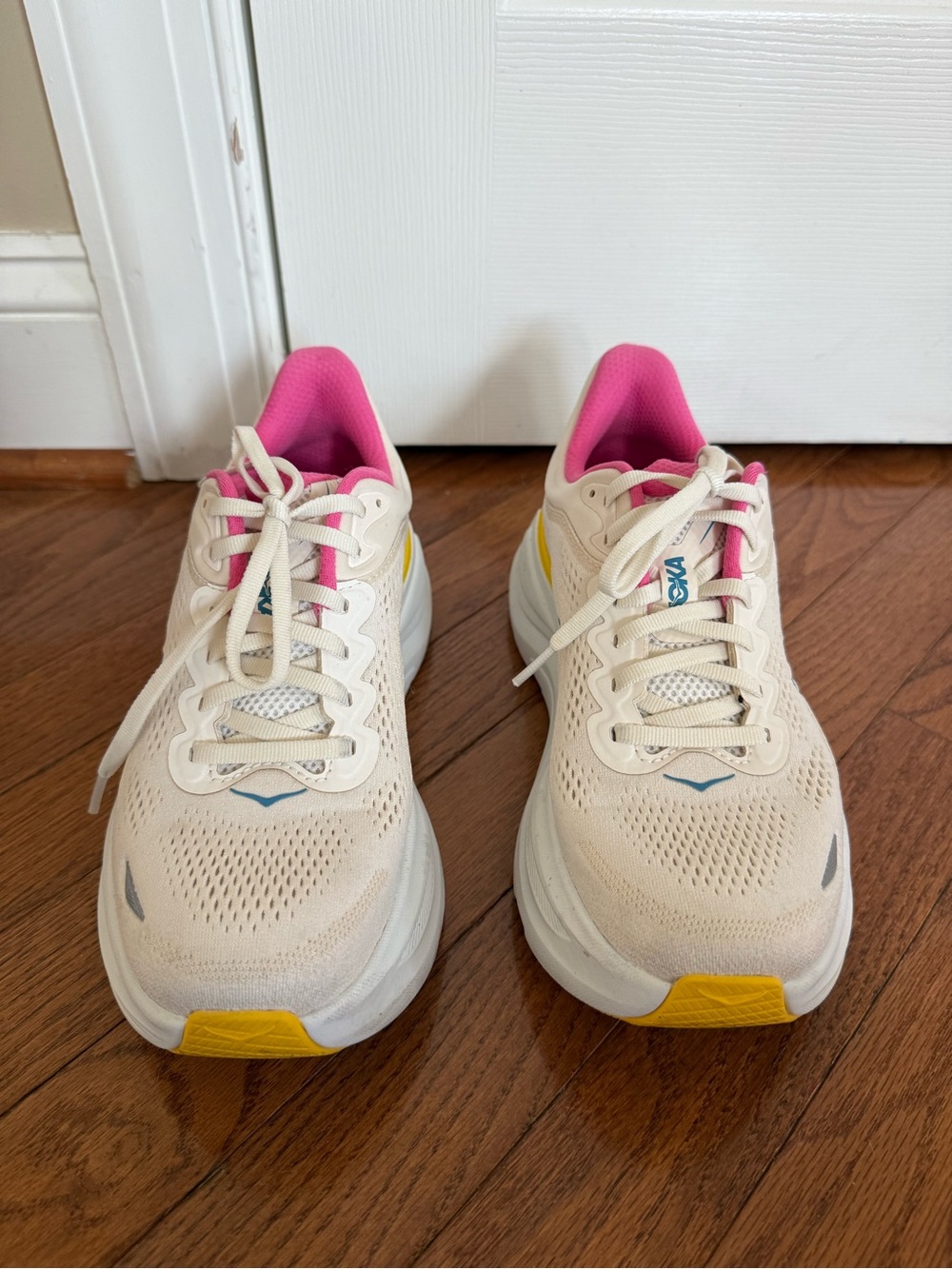 Women’s Hoka Bondi 9 Cream Running Shoes with Pink and Yellow Accents